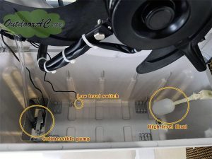 The float switches and pump inside a portable evaporative outdoor AC or cooler